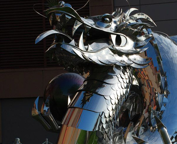 The Chinese Imperial Water Dragon by Kevin Stone, sculptor in polished stainless steel