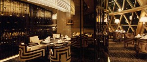 Robuchon au Dome restaurant at the top of the Grand Lisboa hotel in Macau with coloured stainless steel fixtures.