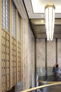 Knightsbridge store, London, UK renovated escalator hall in an Art Deco palette of Double Stone Steel PVD colored stainless steel in Almond Gold Mirror, Black is Black Brush and custom color Nickel Bronze Mirror