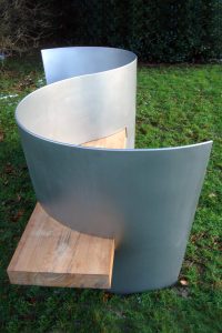 Outdoor bench, the S-seat by architect Ian Ritchie in custom finish Double Stone Steel PVD colored stainless steel Chrome Shot-peened
