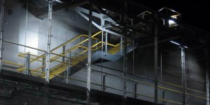 Passenger stairs to platforms at Wood Lane underground station, London UK - Powder coated handrail, balustrades and treads fabricated and installed by John Desmond Ltd, UK and Europe partner to Double Stone Steel - Architect Ian Ritchie Architects