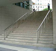 Oval stainless steel handrail with fibre-optic downlights and standards in Columbus Courtyard, Canary Wharf, London
