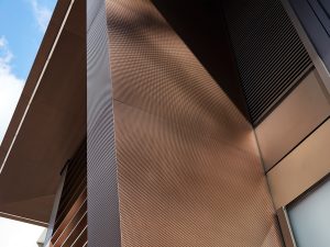 15 Fetter Lane, EC4A, London. - Retrofit façade comprising Brise soleil, canopy and column in Double Stone Steel PVD colored stainless steel Chocolate SB-H25 embossed finish.