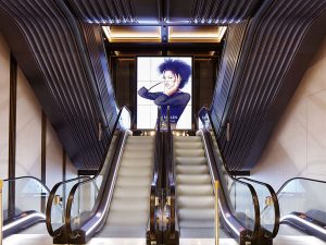 Knightsbridge retail store, London. - Escalator base in Double Stone Steel PVD colored stainless steel Nickel Bronze Vibration (custom). - Trims in Almond Gold, Black is Black and Nickel (Brush and Mirror).