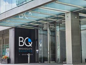 1 Broadgate Quarter, Snowden St, London. - Frameless glazed Stainless Steel Canopy columns and detailing in Double Stone Steel PVD colored stainless steel Nickel Satin.