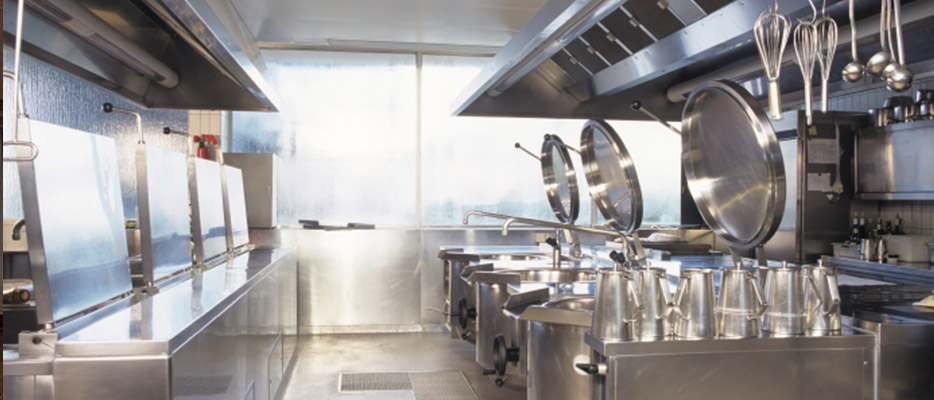 Hotel kitchen interior, London UK - Commercial kitchen deep fat fryers, units and extractors in stainless steel with antimicrobial finish Hotel kitchen interior, London UK - Commercial kitchen deep fat fryers, units and extractors in stainless steel with antimicrobial finish