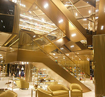 Miu Miu flagship store in Bejing with stairs, panels and merchandising units finished in Double Stone Steel PVD coating Champagne SS04 No 4 brushed. Miu Miu flagship store in Bejing with stairs, panels and merchandising units finished in Double Stone Steel PVD coating Champagne SS04 No 4 brushed.