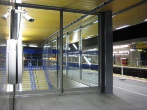 Glazed screen with stainless steel frame to Wood Lane underground station, London UK