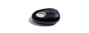 Tateossian paperweight made from obsidian, diamond dust and rose gold.