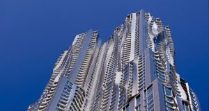 Frank Gehry's first skyscraper, the 76-story New York by Gehry, with its rippling stainless steel cladding curved to look like draped fabric