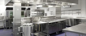 Commercial kitchen with extensive use of stainless steel for surfaces and units