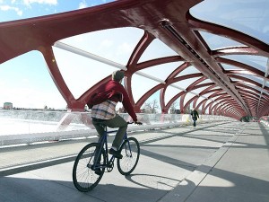 Cyclist using the dedicated cycle track on The Peace Bridge, Calgary.