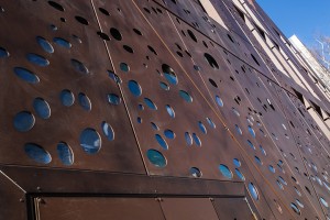 Façade of the Hermitage Gantois Spa. This appears to be rusty steel but is in fact powder-coated aluminium