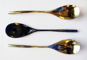 Ordinary stainless steel spoons coated with PVD in Royal Gold and Black is Black. By Double Stone Steel.