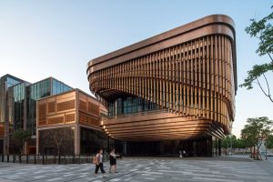 PVD stainless steel in Rose Gold Vibration is used to create the façade of the Shanghai Bund Arts and Cultural Centre and neighbouring building. - Architects: Foster & Partners; Heatherwick Studio - PVD: Double Stone Steel in partnership with John Desmond Ltd