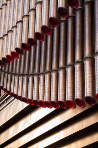 A close-up view of the façade of the Shanghai Bund Arts and Cultural Centre made from PVD stainless steel in Rose Gold Vibration. - Architects: Foster & Partners; Heatherwick Studio - PVD: Double Stone Steel in partnership with John Desmond Ltd