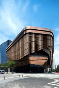 The Shanghai Bund Arts and Cultural Centre showing the moving veil and viewing gallery façade fabricated from PVD stainless steel in Rose Gold Vibration. - Architects: Foster & Partners; Heatherwick Studio - PVD: Double Stone Steel in partnership with John Desmond Ltd