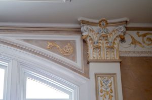 Gold leaf detail on Corinthian bracket, upper detail of the pilaster, simple leaf spandrel, and French crown. By Monumental Plaster Moulding based in Maryland, US