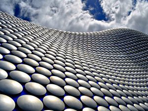 The Selfridges building, Bullring, Birmingham by architectural practice Future Systems. The cladding skin of this iconic curvaceous building, completed in 2003, includes 15,000 anodised aluminium discs.