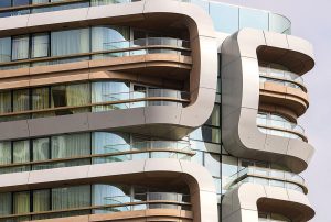 Canaletto Building, Islington by architectural practice UN Studio. This landmark 2017 tower has metallic silver anodised aluminium feature cladding for its curved balconies