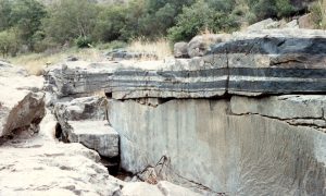 The vast Bushveld Igneous Complex of South Africa is a large layered mafic to ultramafic igneous body with some layers consisting of 90% chromite making the rare rock type, chromitite.