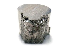 A piece of the chemical element nickel (Ni). Nickel is resistant to corrosion and is used pre-eminently as an alloying metal in nickel steels and nickel cast irons.