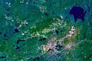 The Sudbury and Wanapitei impact craters in Ontario, Canada were created by asteroids crashing into the earth billions of years ago. The nickel-rich Sudbury Basin is the large, elliptical structure (60 x 30 km).