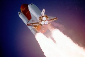 NASA space shuttle and launcher rockets heading into space after take-off. Nickel and other metals are used to create high strength metal alloys for construction.