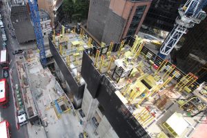 View of the building site from above, we can see how the multiple pieces of construction equipment are organized to allow for the builders to move around the site. 22 Bishopsgate designed by PLP Architects, construction by Multiplex. Photo from Careys Design Team by Lobster Pictures.
