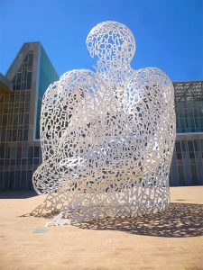 Jaume Plensa, Alma del Ebro, Zaragoza (2008). The 11 m high sculpture traces the pass of time on the floor with its changing shadows. It invites the people to enter the space enclosed and reflect about themselves.