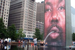 Jaume Plensa, Crown Fountain, Chicago (2004). Two towers made of glass blocks display images of anonymous people that discontinuously throw a water jet. Here Plensa reflects on the role of public fountains and the interaction of art and audience.