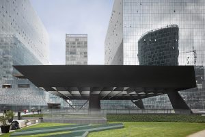 Cervantes Theatre in Mexico. Front elevation, the steel girder is covered by glass panels that let the light through to the lower levels. Architecture: Ensamble Studio, Antón García-Abril and Débora Mesa. Photograph by Roland Halbe ©.