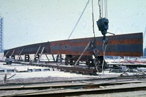 Neue Nationalgalerie steel beam on site during the construction. The different steel elements were moved on rails and pulled by lorries to their correct location. Architecture: Mies Van der Rohe. Photograph by Heinz Oeter.