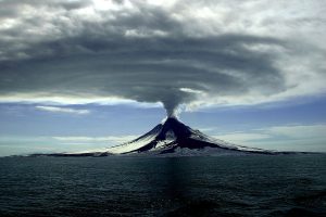 An erupting volcano emitting a toxic cocktail of gases into the Earth’s atmosphere. The gases released include carbon dioxide, nitrogen and sulfur dioxide.