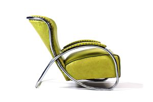Lounge chair designed by Kem Weber for the Lloyd Manufacturing Company in the 1930s. Weber was known for the use of flowing tubular, stainless steel in his furniture.