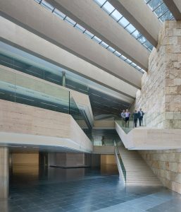 Castelar Building. Architects: Rafael de la Hoz Arderius and Gerardo Olivares. Internal atrium view. Rafael del Hoz Castanys, son of the architect, undertook the renovation works in 2010. Brickwork walls inside the atrium were substituted by rough stone blocks in line with the original vision of the project. Photography by Duccio Malagamba