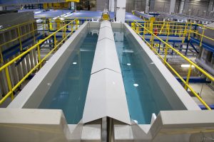 Rinsing baths in a fully automated aluminium anodizing plant. The process of anodization utilises electrolysis to give metals a corrosion resistant anodic coating. Photography by Galvatek.